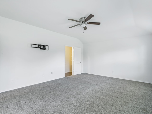 unfurnished living room featuring vaulted ceiling and dark wood-type flooring