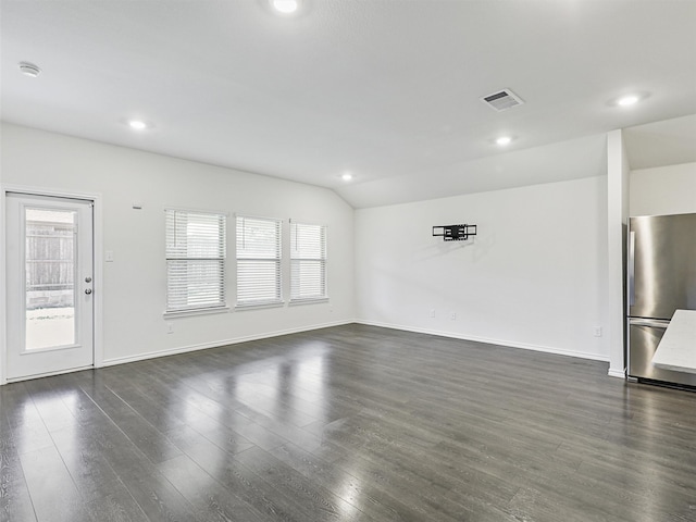 empty room with ceiling fan, carpet floors, and lofted ceiling