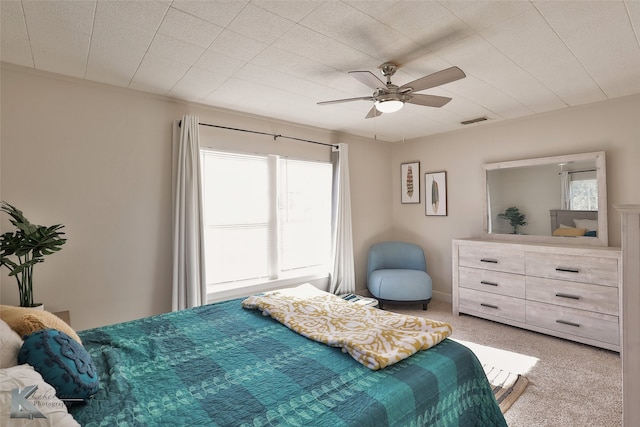 bedroom featuring ceiling fan and light colored carpet