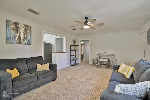 carpeted living room featuring ceiling fan