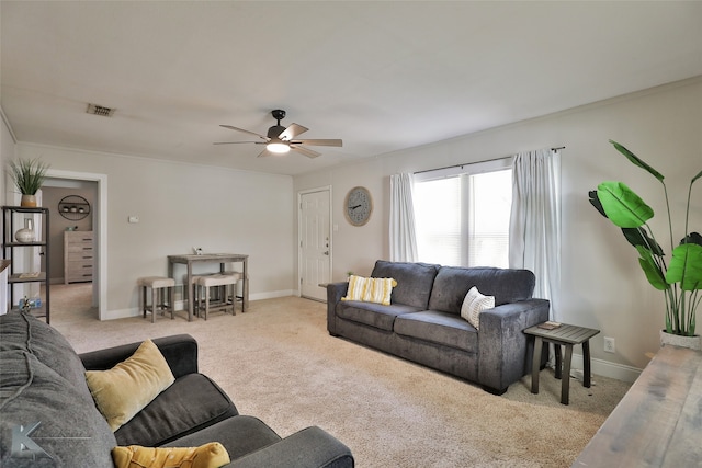 carpeted living room with ceiling fan