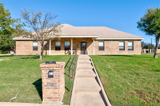 ranch-style house with a front lawn