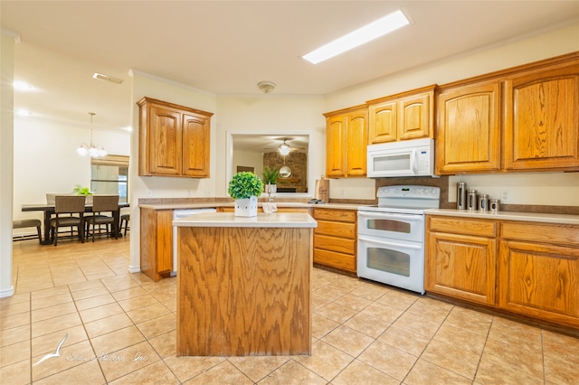 kitchen with a center island, decorative light fixtures, white appliances, light tile patterned floors, and ceiling fan with notable chandelier