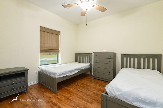 bedroom featuring ceiling fan and dark hardwood / wood-style flooring