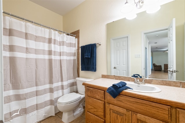 bathroom featuring tile patterned floors, vanity, and toilet