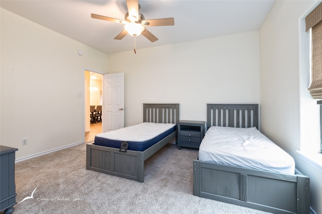 bedroom with ceiling fan and carpet