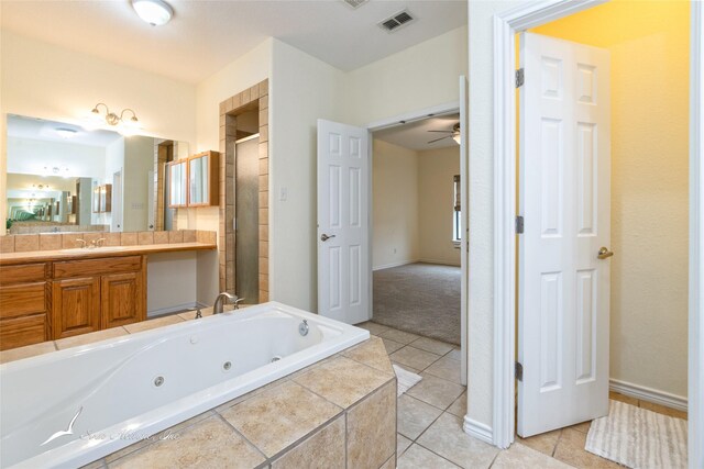 bathroom with tile patterned floors, ceiling fan, vanity, and independent shower and bath