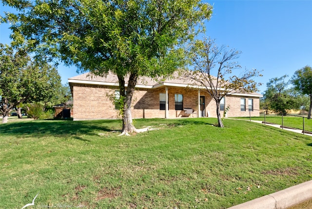 ranch-style house with a front lawn