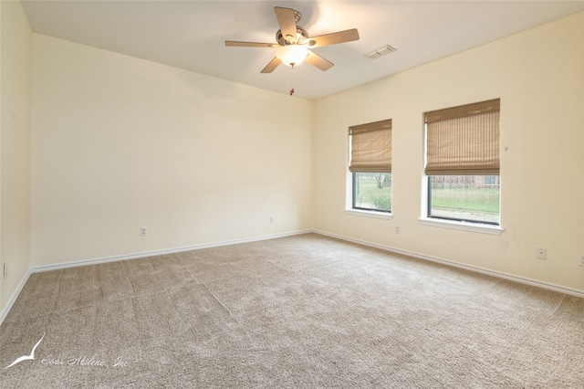 spare room with carpet flooring and ceiling fan