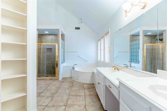 bathroom with tile patterned floors, vanity, independent shower and bath, and vaulted ceiling