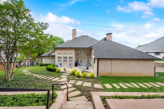 back of property with a patio area