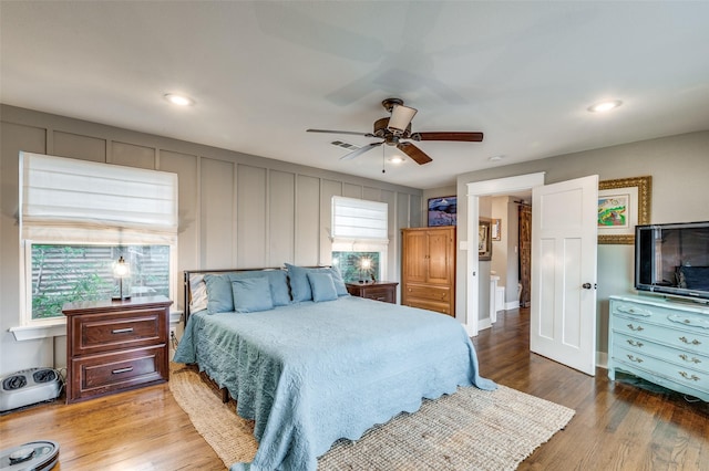 bedroom featuring light hardwood / wood-style floors and ceiling fan