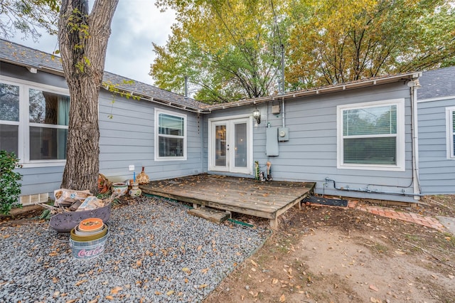 back of house with french doors and a deck