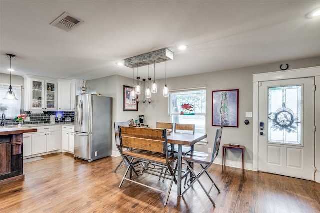 dining area with hardwood / wood-style flooring