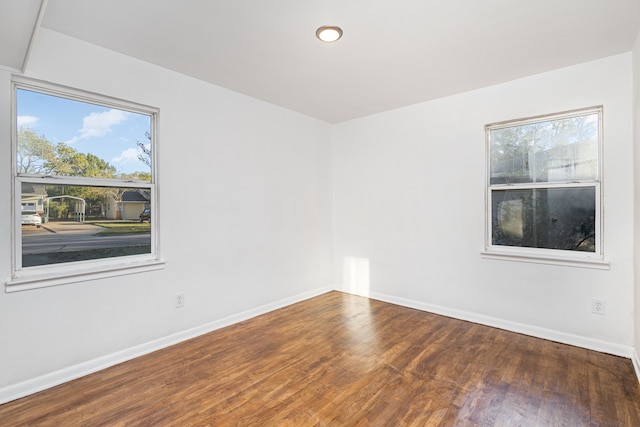 spare room with hardwood / wood-style flooring