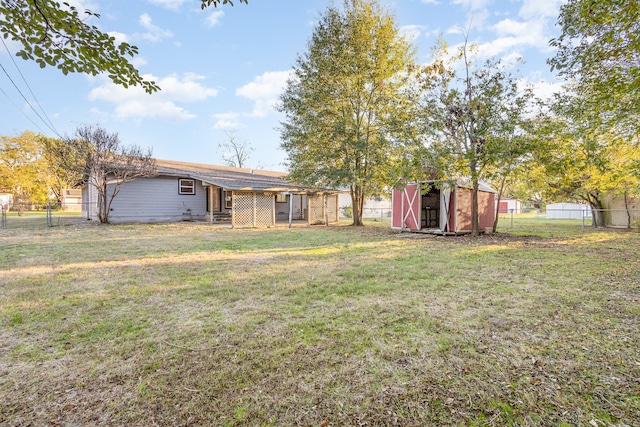 view of yard with a storage unit