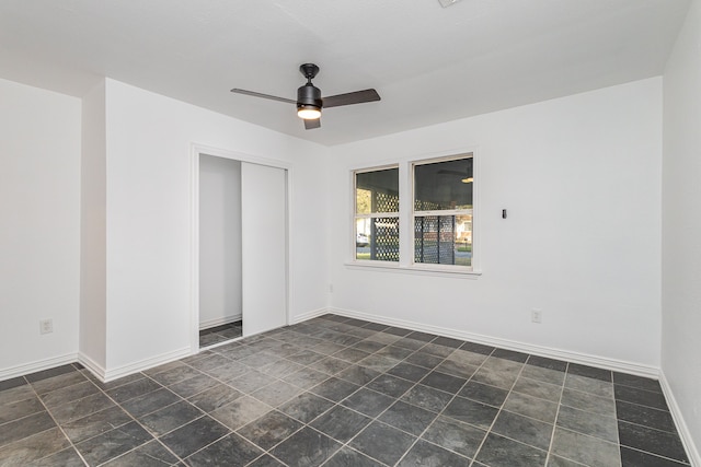 spare room with ceiling fan