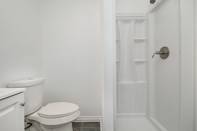 bathroom with walk in shower, tile patterned flooring, vanity, and toilet