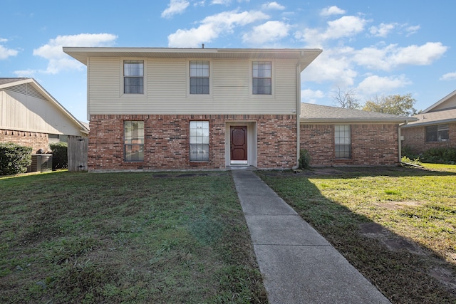 view of property featuring central AC unit and a front lawn