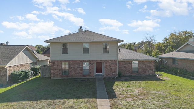 back of property featuring a yard