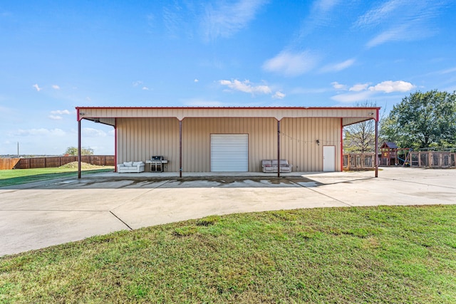 view of outbuilding featuring a yard