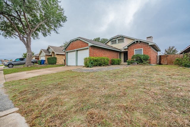 view of front of house with a garage and a front lawn