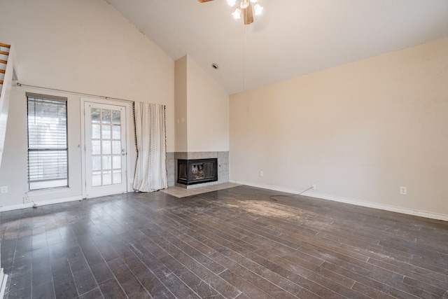 unfurnished living room with ceiling fan, dark hardwood / wood-style flooring, and high vaulted ceiling