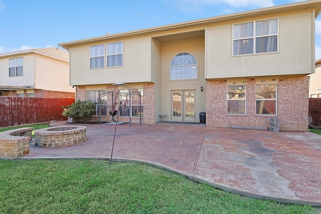 back of house featuring a gazebo, an outdoor fire pit, and a patio area