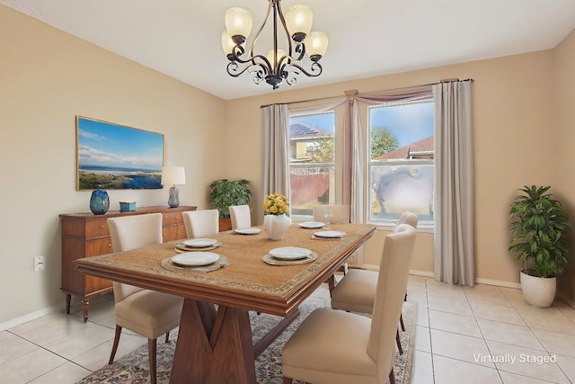 dining space featuring a notable chandelier and light tile patterned floors