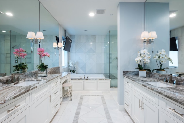 bathroom featuring tile patterned floors, vanity, and independent shower and bath