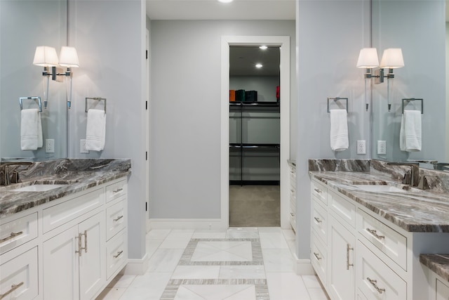 bathroom with tile patterned flooring and vanity