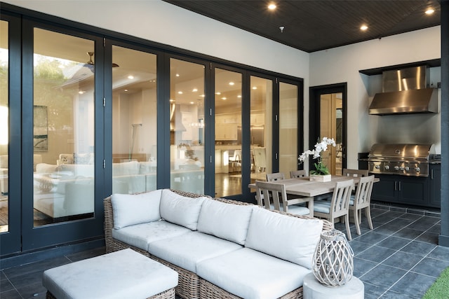 living room featuring dark tile patterned floors and wood ceiling