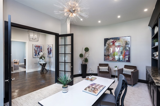 office with a chandelier and french doors