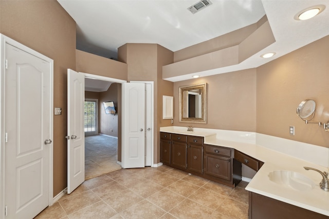 bathroom with vanity and tile patterned floors