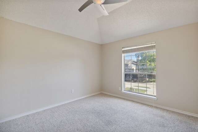 unfurnished room with carpet flooring, ceiling fan, and a textured ceiling