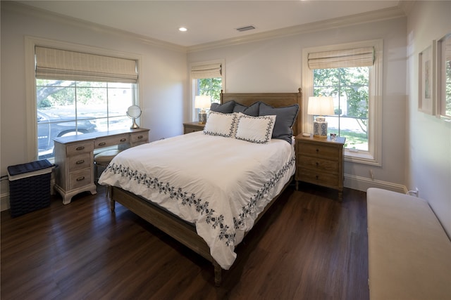 bedroom featuring dark hardwood / wood-style floors and crown molding