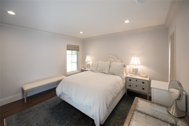 bedroom featuring dark hardwood / wood-style flooring and crown molding