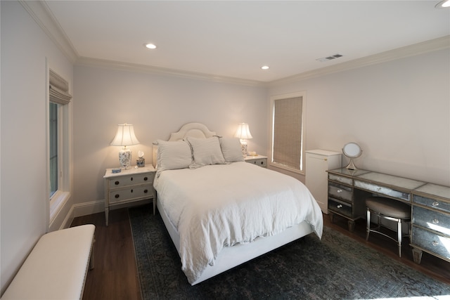 bedroom with crown molding and dark wood-type flooring