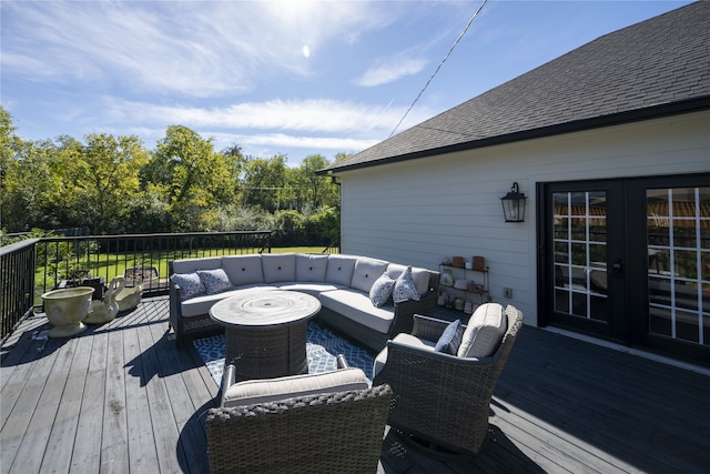 wooden terrace with an outdoor hangout area