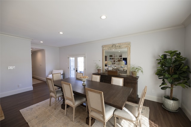 dining space featuring crown molding, french doors, and dark wood-type flooring