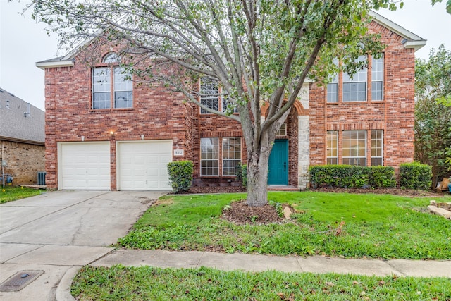 front facade with a front lawn and a garage