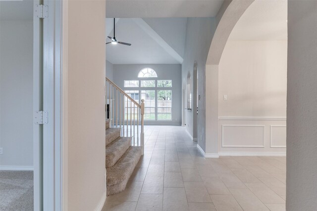 tiled foyer entrance with ceiling fan