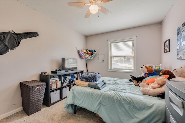 bedroom featuring light carpet and ceiling fan