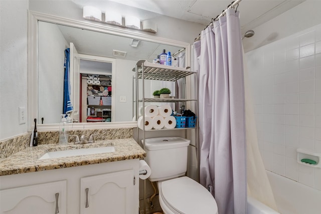 full bathroom featuring vanity, toilet, and shower / bath combo with shower curtain