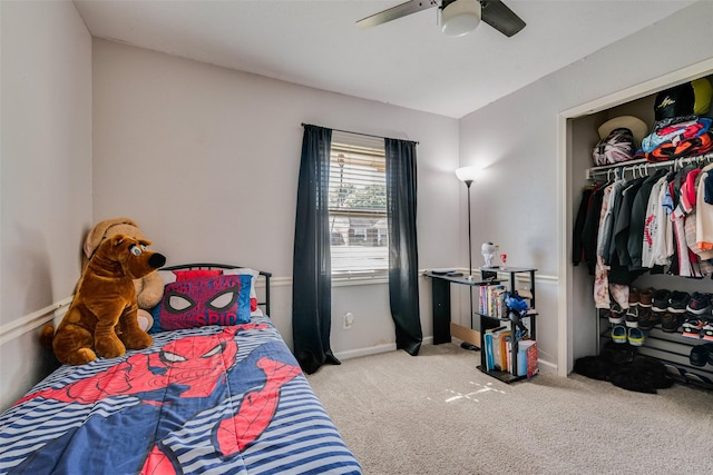 bedroom featuring light colored carpet, a closet, and ceiling fan