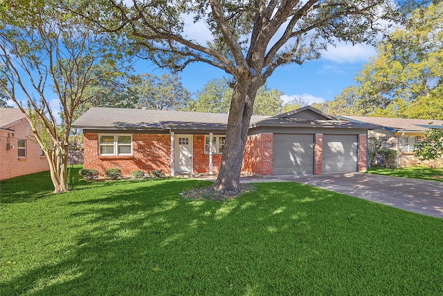 ranch-style home featuring a garage and a front lawn