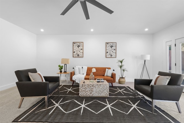 living room featuring ceiling fan and carpet floors