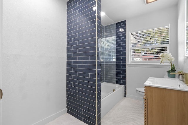 full bathroom with tile patterned floors, vanity, toilet, and tiled shower / bath