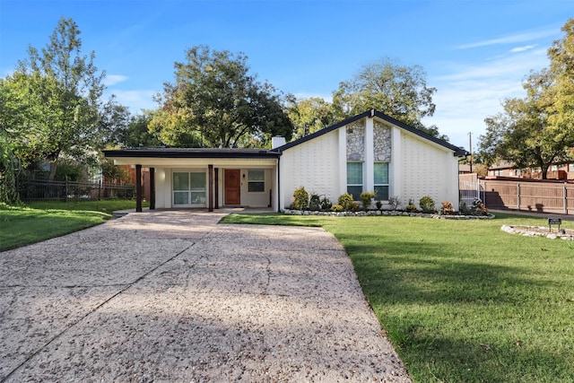 ranch-style home with a porch and a front yard