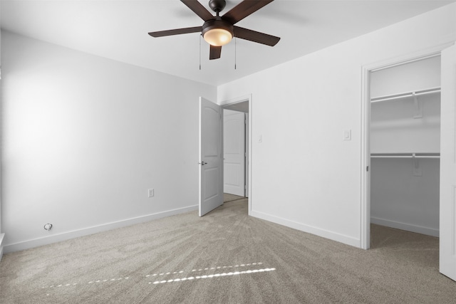 unfurnished bedroom with ceiling fan, a closet, and light colored carpet